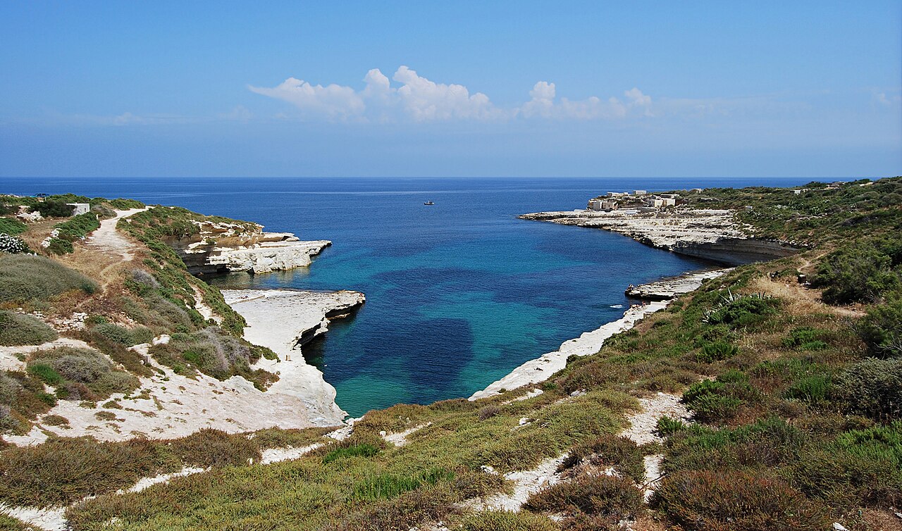 A bay between white limestone cliffs